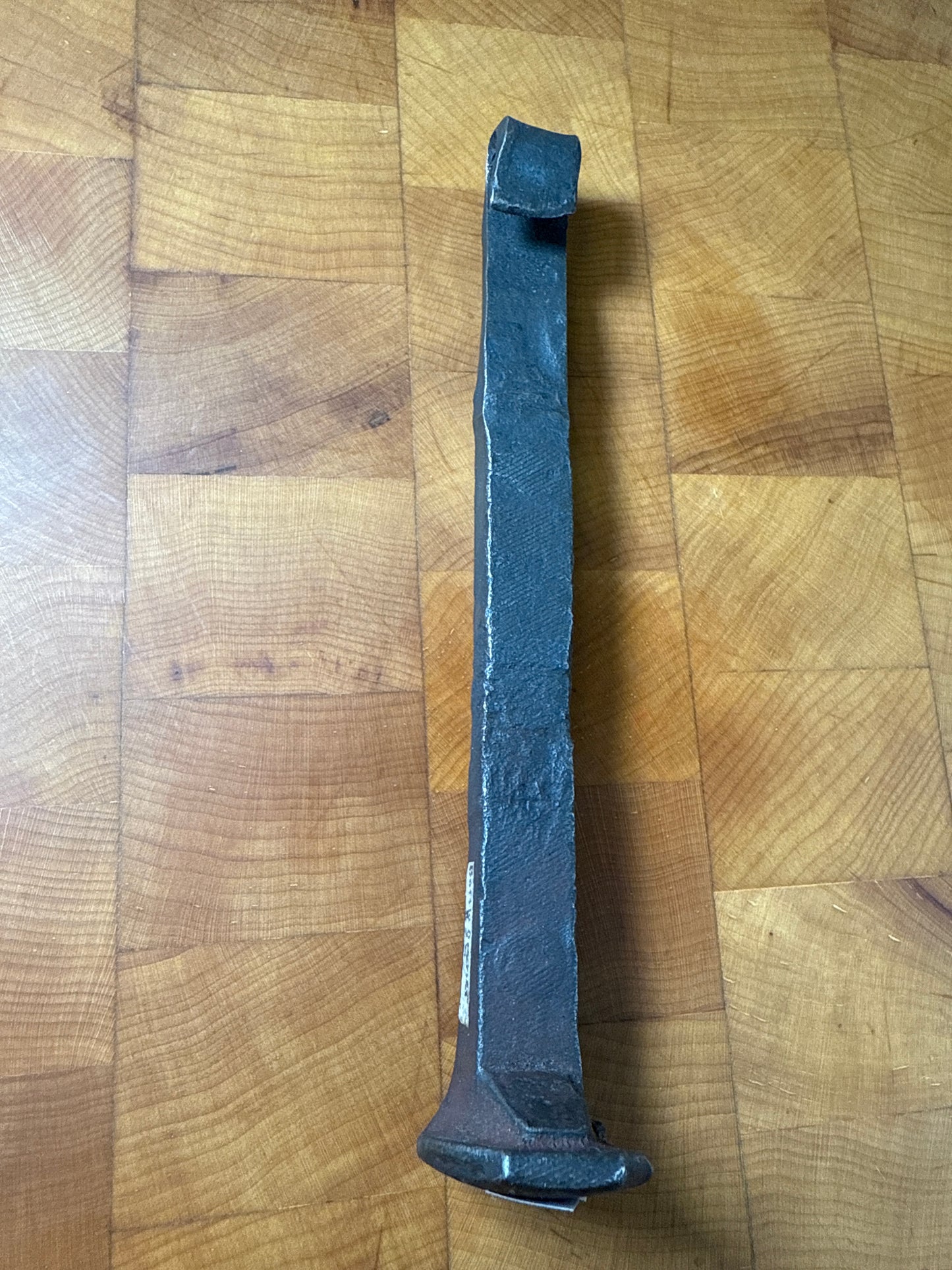 Railroad spike bottle opener