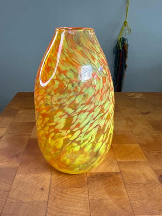 Tall orange glass vase